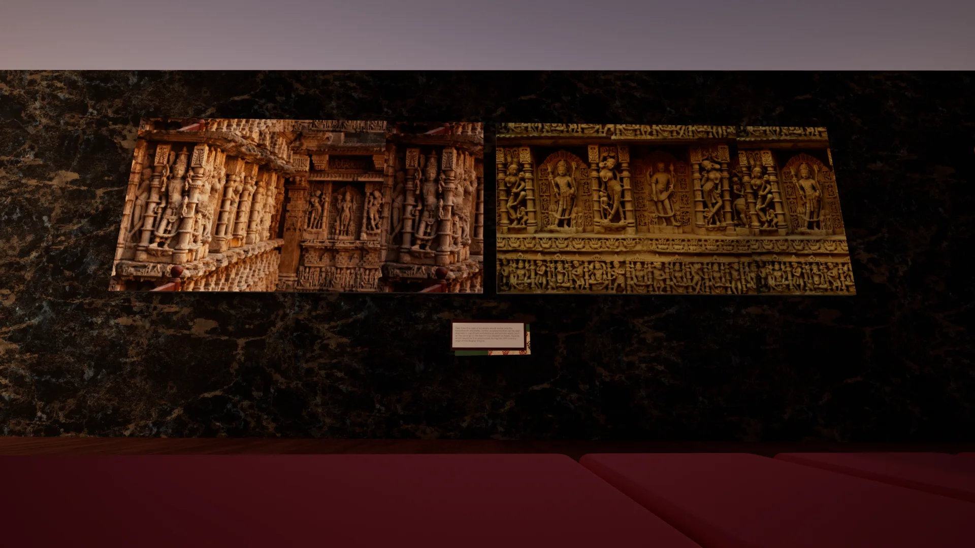 Two framed photographs of carved stone temple walls on a black marble wall with a small label below