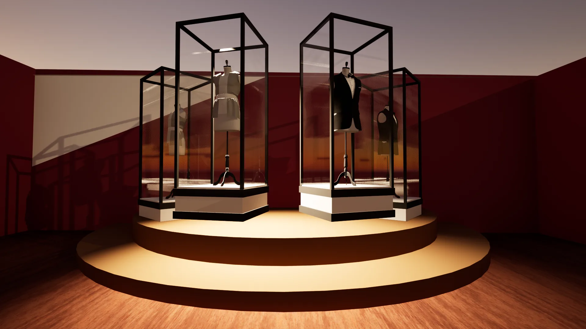Circular two step dais with four glass display cases holding mannequins in a tuxedo and other formal garments