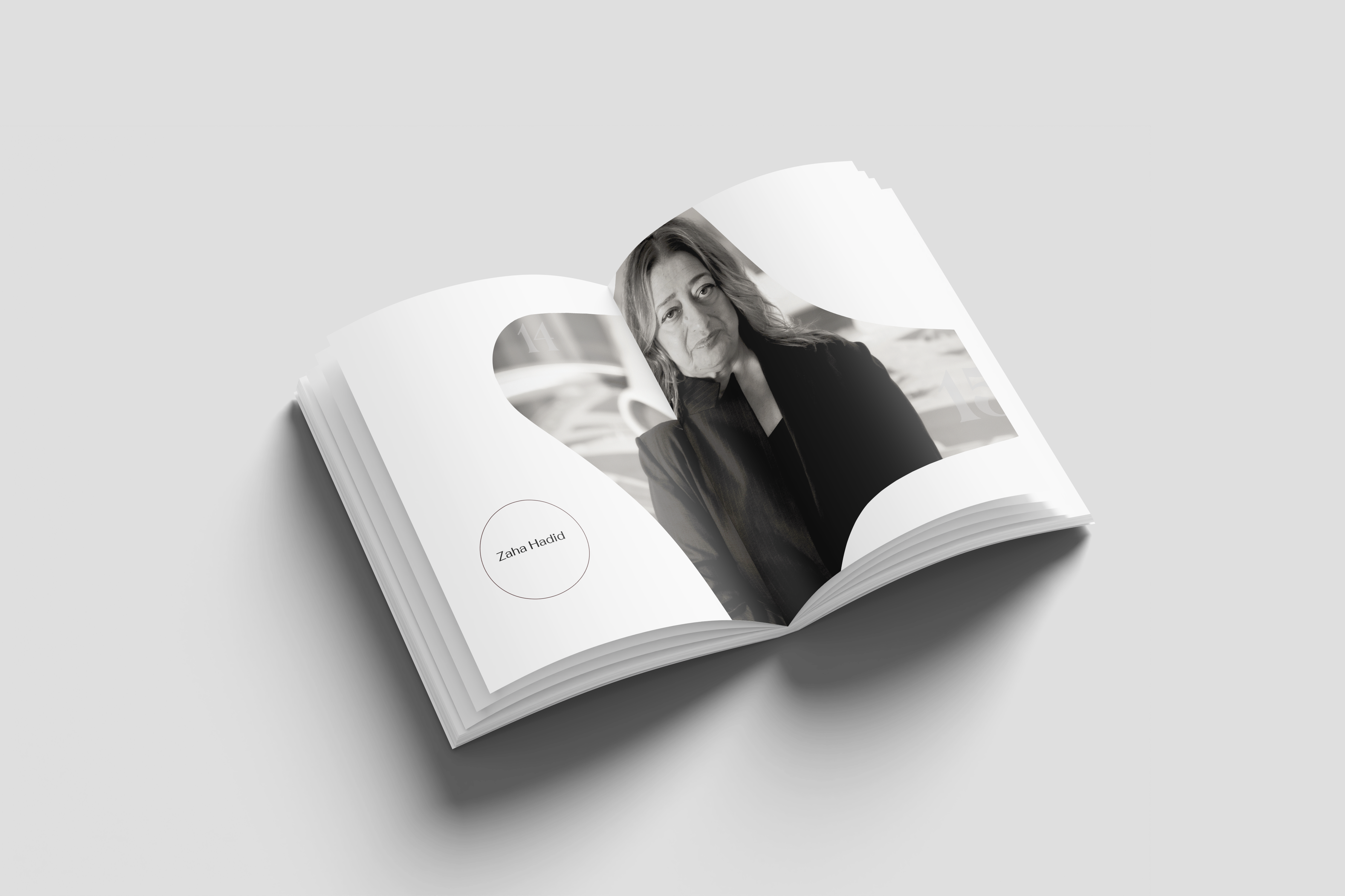 Open book with a black and white portrait of Zaha Hadid on a curved cut-out and a circle labelled Zaha Hadid
